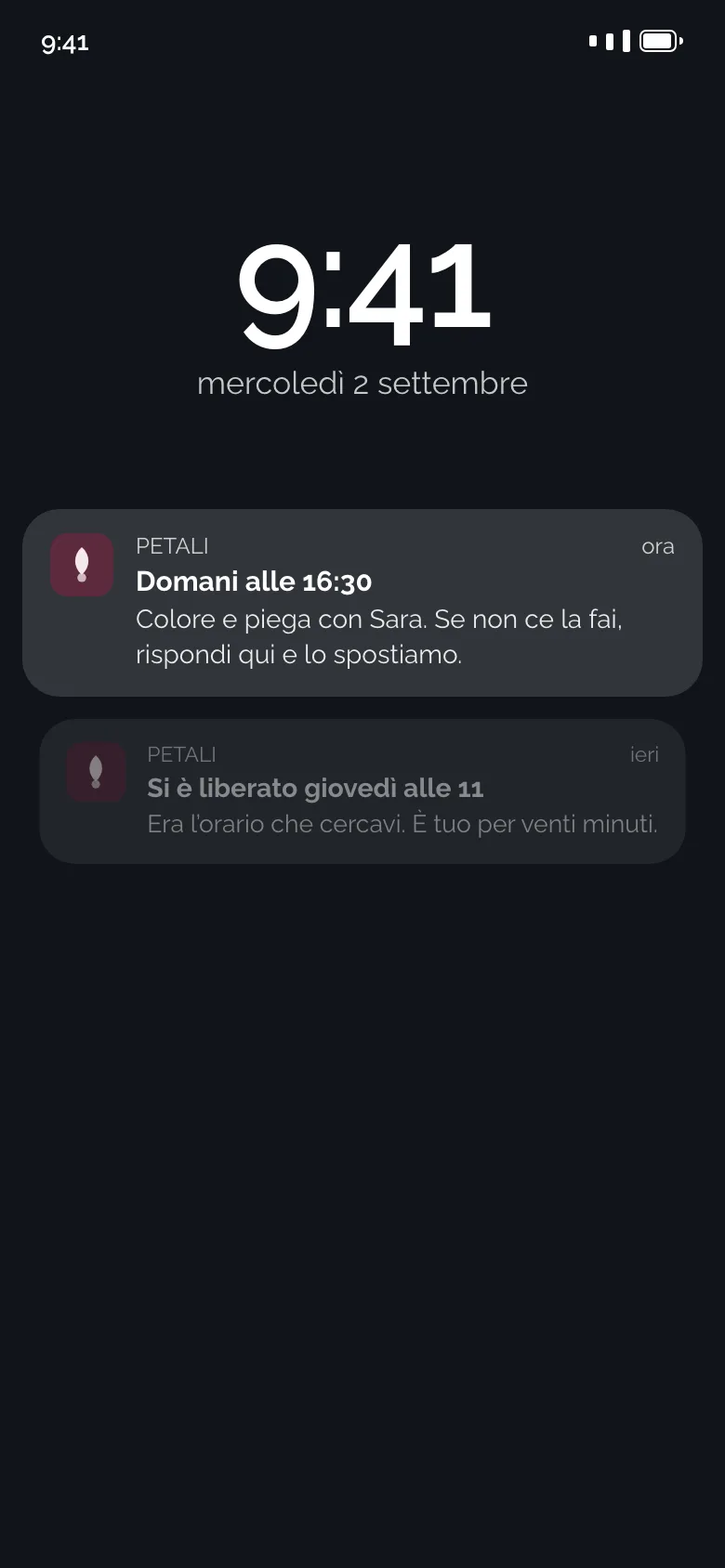 La schermata di blocco di un telefono con l’avviso del salone: il promemoria di domani e l’orario che si è liberato